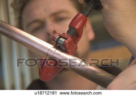 Working with copper pipe View Large Photo Image Stock Image - Working with copper pipe. Fotosearch