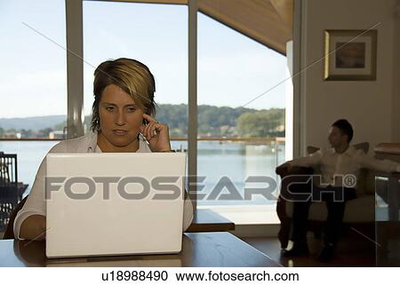 Stock Image - Working woman. Fotosearch