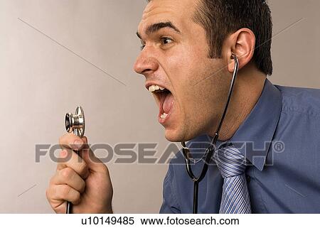 Stock Photography - Yelling into a stethoscope. Fotosearch
