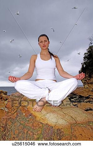 Stock Photograph - Yoga outdoors. Fotosearch