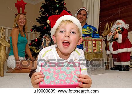Young boy Christmas morning View Large Photo Image Stock Photo - Young boy Christmas morning. Fotosearch