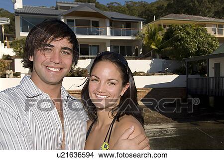 Young couple at home View Large Photo Image Picture - Young couple at home. Fotosearch