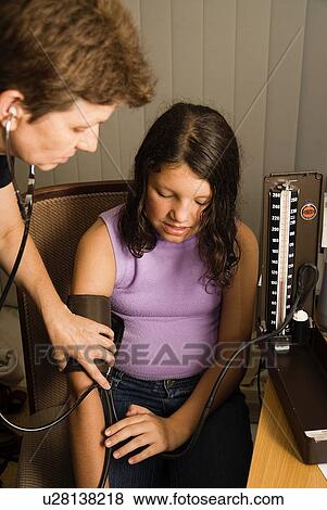 Young girl at doctors View Large Photo Image Stock Photo - Young girl at doctors. Fotosearch