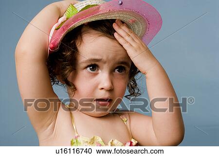 Stock Image - Young girl with hat. Fotosearch