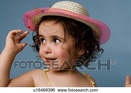 Young girl with hat View Large Photo Image Stock Photograph - Young girl with hat. Fotosearch