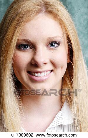 Young woman smiling View Large Photo Image Stock Image - Young woman smiling. Fotosearch