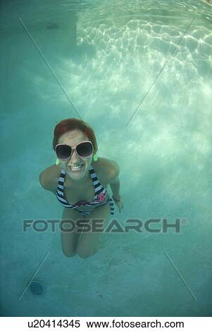 A female swimming under water View Large Photo Image Stock Photography - A female swimming under water. Fotosearch