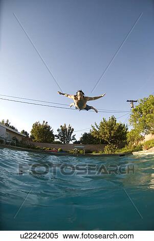 A male diving into a pool View Large Photo Image Stock Photography - A male diving into a pool. Fotosearch