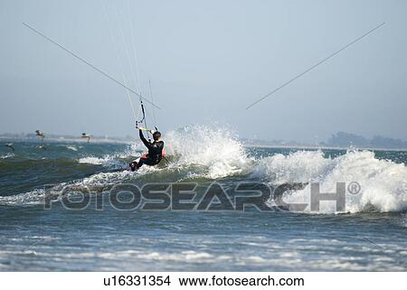 A male kite surfing View Large Photo Image Picture - A male kite surfing. Fotosearch