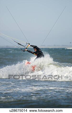 A male kite surfing View Large Photo Image Picture - A male kite surfing. Fotosearch
