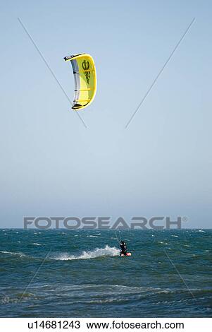A male kite surfing View Large Photo Image Stock Image - A male kite surfing. Fotosearch
