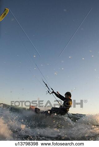 A male kite surfing View Large Photo Image Stock Photo - A male kite surfing. Fotosearch