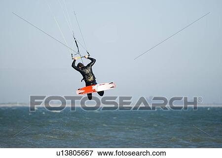 A male kite surfing View Large Photo Image Stock Photo - A male kite surfing. Fotosearch
