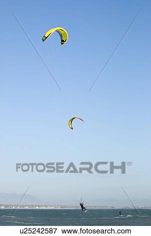 A male kite surfing View Large Photo Image Stock Photo - A male kite surfing. Fotosearch