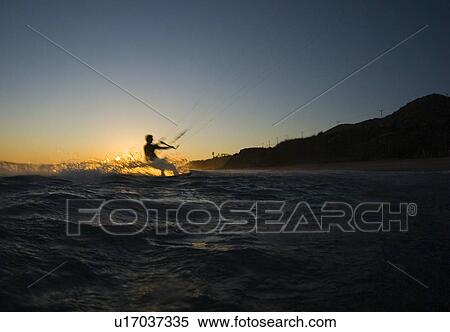 A male kite surfing View Large Photo Image Stock Photography - A male kite surfing. Fotosearch