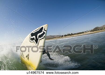 Picture - A male surfer. Fotosearch