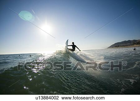 A male surfer View Large Photo Image Stock Image - A male surfer. Fotosearch