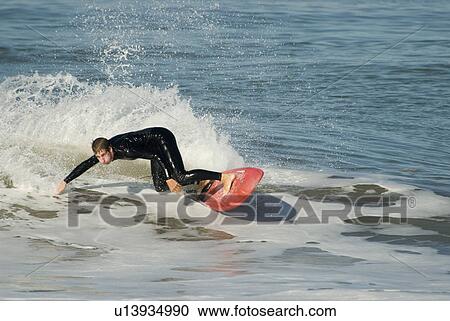 A male surfer View Large Photo Image Stock Image - A male surfer. Fotosearch