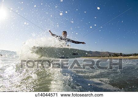 Stock Image - A male surfer. Fotosearch