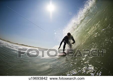 Stock Image - A male surfer. Fotosearch