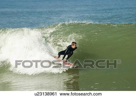 Stock Image - A male surfer. Fotosearch