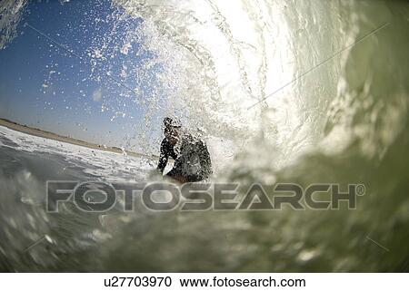 Stock Image - A male surfer. Fotosearch