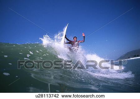 Stock Image - A male surfer. Fotosearch