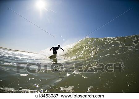 A male surfer View Large Photo Image Stock Photo - A male surfer. Fotosearch