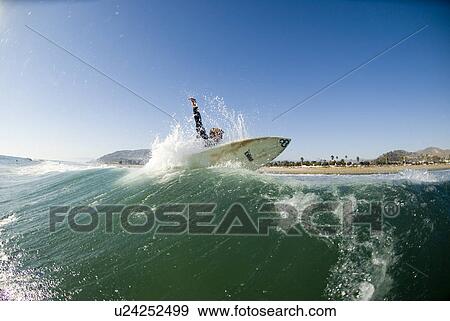A male surfer View Large Photo Image Stock Photo - A male surfer. Fotosearch