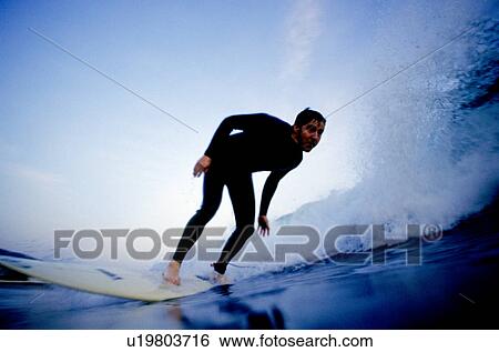 A male surfer View Large Photo Image Stock Photograph - A male surfer. Fotosearch