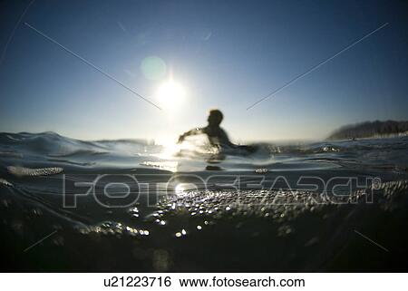 Stock Photograph - A male surfer. Fotosearch