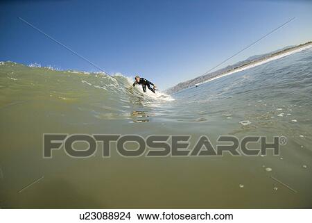 A male surfing View Large Photo Image Picture - A male surfing. Fotosearch