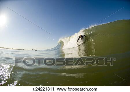 A male surfing View Large Photo Image Stock Image - A male surfing. Fotosearch