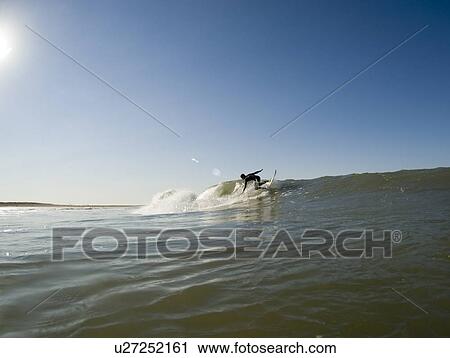 A male surfing View Large Photo Image Stock Image - A male surfing. Fotosearch