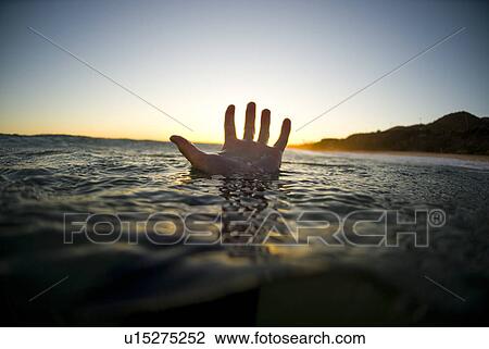 A male's hand in the water View Large Photo Image Stock Image - A male's hand in the water. Fotosearch
