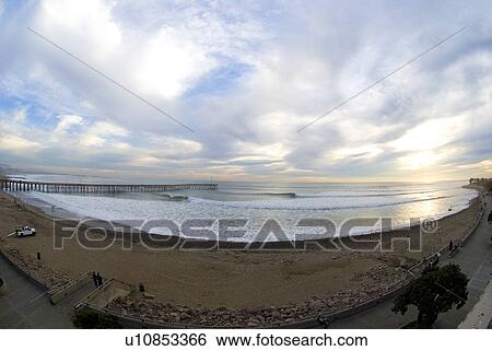 A wide angle fish eye shot of surfers point during a huge swell wave Ventura California USA View Large Photo Image Stock Photograph - A wide angle fish eye shot of surfers point during a huge swell wave Ventura California USA. Fotosearch
