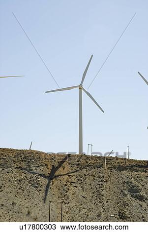 Stock Image - A windmill farm in the desert near Palm Springs California. Fotosearch