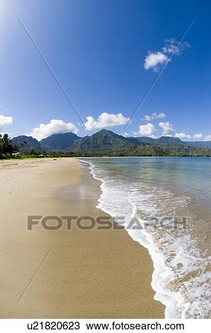 Stock Image - Beach at Hanalei Bay Princeville Kauai Hawaii USA. Fotosearch