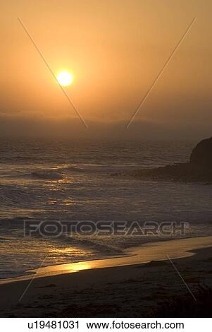 Beach at sunset View Large Photo Image Stock Image - Beach at sunset. Fotosearch