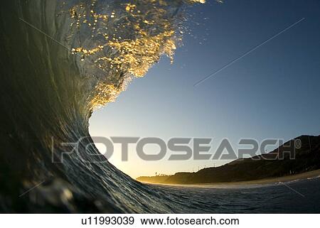 Breaking waves at sunset View Large Photo Image Stock Photo - Breaking waves at sunset. Fotosearch