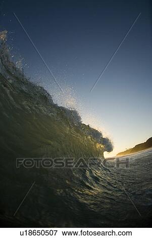 Breaking waves at sunset View Large Photo Image Stock Photo - Breaking waves at sunset. Fotosearch