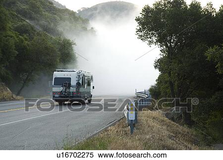 Camper on foggy road View Large Photo Image Stock Photography - Camper on foggy road. Fotosearch