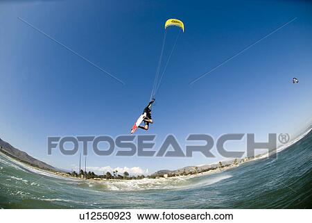 Extreme kite surfer in the air View Large Photo Image Stock Image - Extreme kite surfer in the air. Fotosearch