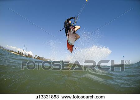 Extreme kite surfer in the air View Large Photo Image Stock Image - Extreme kite surfer in the air. Fotosearch