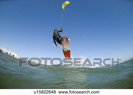 Extreme kite surfer in the air View Large Photo Image Stock Photo - Extreme kite surfer in the air. Fotosearch