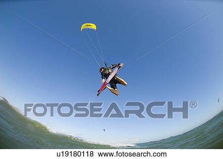 Extreme kite surfer in the air View Large Photo Image Stock Photo - Extreme kite surfer in the air. Fotosearch