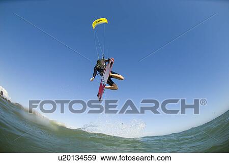 Extreme kite surfer in the air View Large Photo Image Stock Photo - Extreme kite surfer in the air. Fotosearch