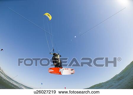 Extreme kite surfer in the air View Large Photo Image Stock Photo - Extreme kite surfer in the air. Fotosearch