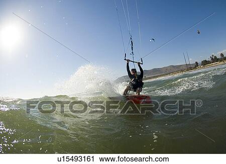 Extreme kite surfer in the water View Large Photo Image Stock Image - Extreme kite surfer in the water. Fotosearch