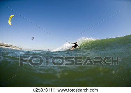 Extreme kite surfer in the water View Large Photo Image Stock Image - Extreme kite surfer in the water. Fotosearch